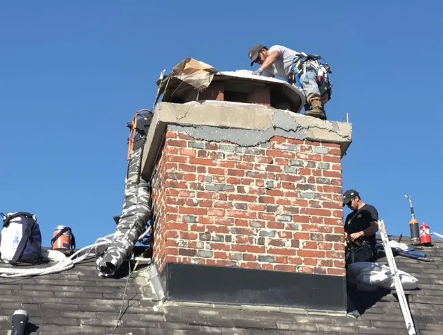 Margate Chimney Sweep installing a custom chimney crown in Margate, FL